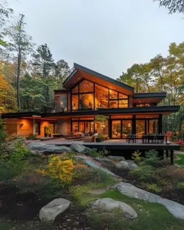 Modern forest house with warm exterior lighting